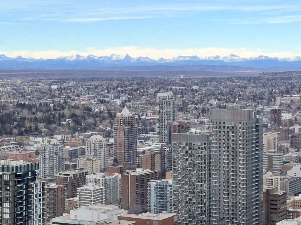 Calgary skyline with Rocky Mountains in Alberta Canada